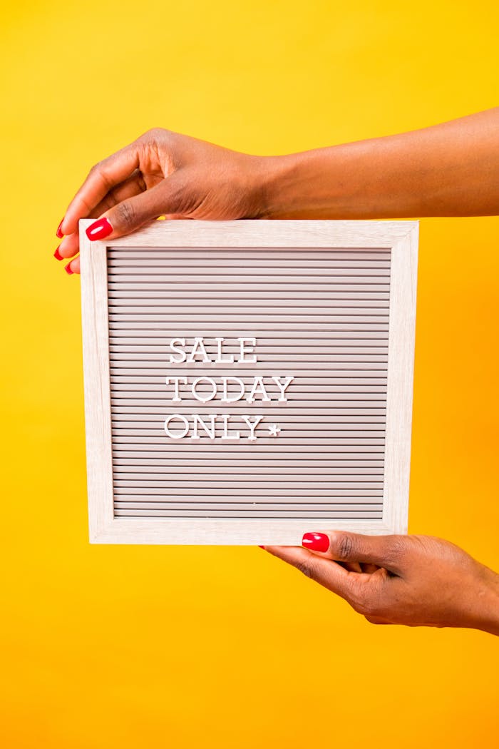 services-img Square letter board with 'SALE TODAY ONLY' held by hands against a vibrant yellow background.